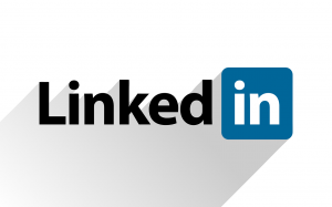 LinkedIn is a personal social media site. Use your  personal email address for personal sites